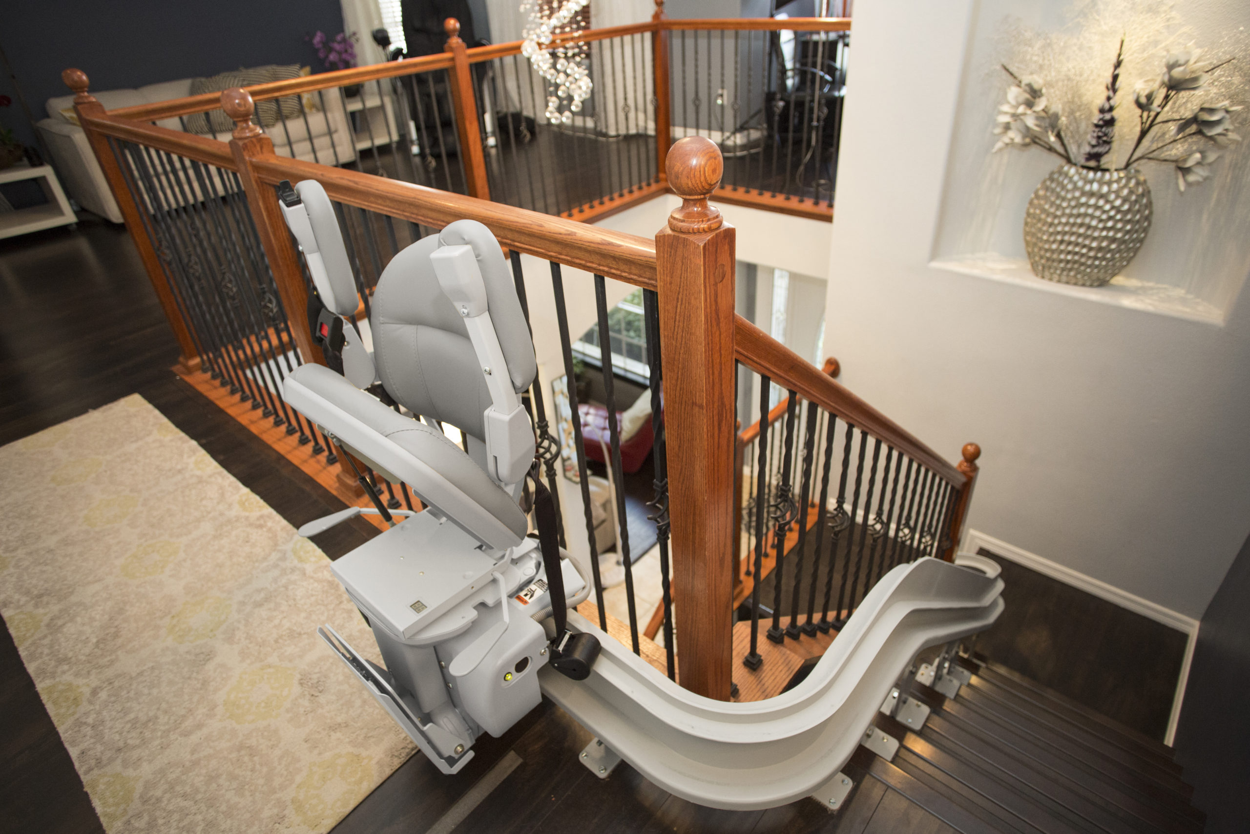 Curved stair lift at top of stairs in Peoria, IL, home