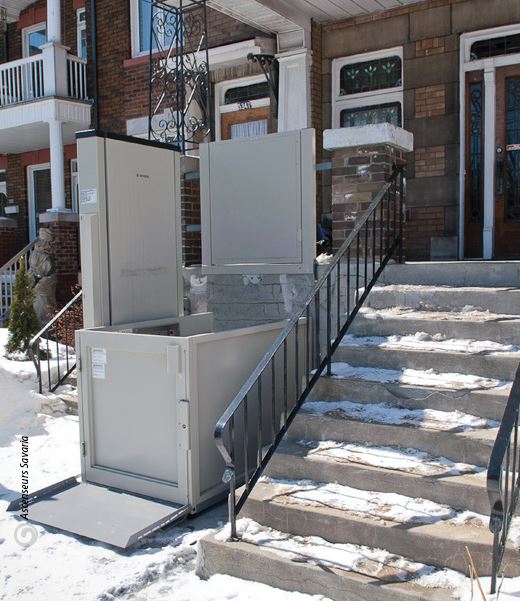 Exterior porch lift, known as a vertical platform lift, oustide of a Racine, WI, home