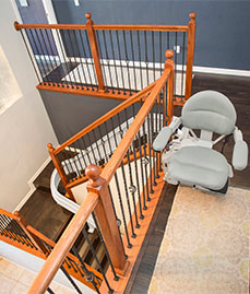 Curved Stairlift at Top of Stairs in House in Peoria, Bloomington, Chicagoland, Glenview, Sheboygan, Hinsdale