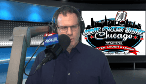 A man wearing headphones speaks into a microphone in a radio studio. Behind him is a screen displaying the Home Sweet Home Chicago logo and WGN Radio 720, with show details for Saturdays from 10am to 1pm.