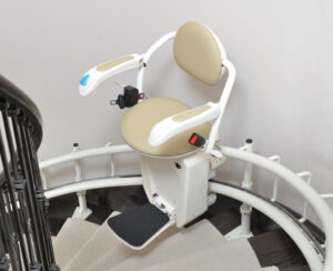 Tan and White Curved Stairlifts on Staircase in DeKalb, Chicagoland, Frankfort, McHenry, Bloomington, Hinsdale