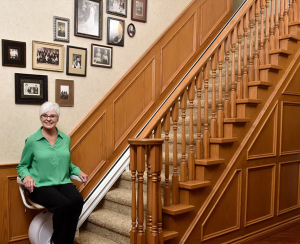 woman on chairlift after Stair Lift Installation in Onalaska, WI
