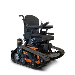 A rugged, all-terrain electric wheelchair with black and orange tank-like tracks, a joystick control, padded seat, and adjustable armrests, designed for enhanced mobility over rough surfaces.