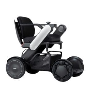 A modern, black electric wheelchair with large wheels, a cushioned seat, armrests, and sleek, minimal design elements. The wheelchair has a futuristic appearance and appears equipped for indoor and outdoor use.