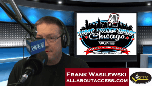 A man speaks into a microphone in a radio studio. Behind him is a screen showing the Home Sweet Home Chicago show logo. A banner at the bottom reads Frank Wasilewski, allaboutaccess.com.