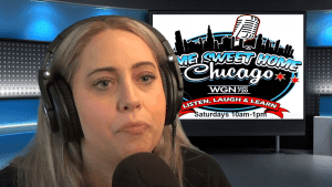 A woman with long blonde hair wearing large headphones speaks into a microphone. Behind her is a screen with the “Home Sweet Home Chicago” radio show logo and broadcast details.