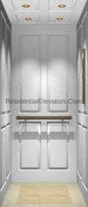 White paneled residential elevator interior with recessed ceiling lights, a narrow handrail along the back wall, and a light-colored floor.