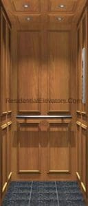 A small residential elevator interior with wood-paneled walls, recessed ceiling lights, a handrail, and dark patterned flooring.