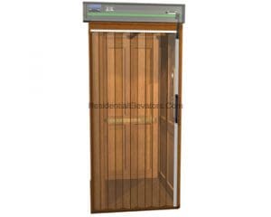 A residential elevator with a wooden interior and vertical lines, seen with a transparent sliding door partially open, and a control panel located above the entrance.