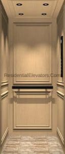 A residential elevator interior with light wood paneling, recessed ceiling lights, a horizontal black handrail, and a tiled floor. The walls feature decorative molding.