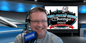 Frank from Access wearing glasses and headphones smiles while speaking into a microphone in a radio studio. Behind him is a screen displaying the Home Sweet Home Chicago show logo and details for WGN 720 radio.