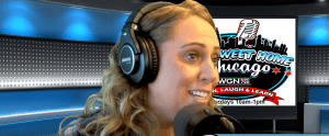 A woman with wavy blonde hair wears headphones and speaks into a microphone in a radio studio. Behind her, a screen displays the Sweet Home Chicago logo and WGN Radio 720 information.