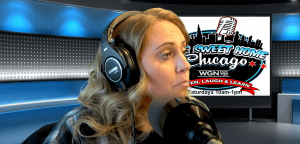 A woman with long blonde hair wearing headphones speaks into a microphone in a radio studio. A screen behind her displays the Sweet Home Chicago show logo with broadcast details.