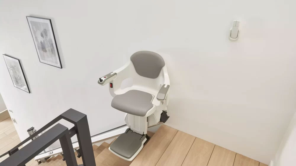 Access BDD HomeGlide Extra Straight Stair Lift at Top of Stairs in Unfolded Position
