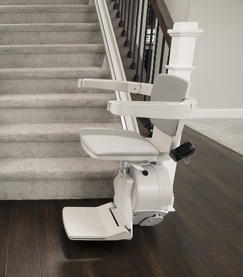 Side View of Bruno Elan Straight Stair Lift at Bottom of Stairs in Home
