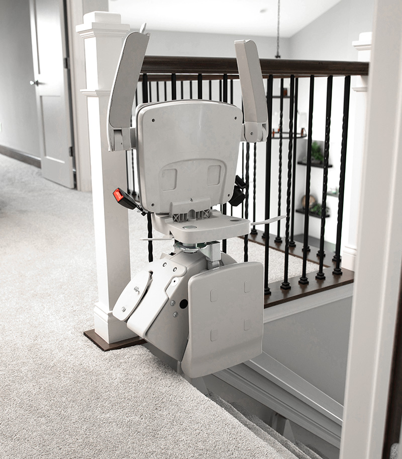 Bruno Elan Straight Stairlift at top of Staircase in Folding Position