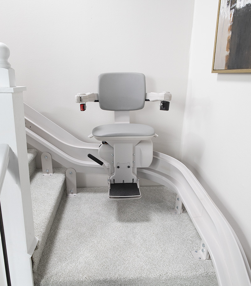 Bruno Elite Heavy Duty Curved Stair Lift In Middle of Rail At Curve