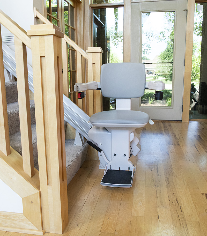 Straight-on View of Bruno Elite Heavy Duty Straight Stairlift in Home on Staircase with Two Handrails