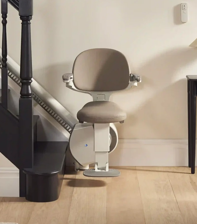 Access BDD HomeGlide Front View with Lift at Bottom of Stairs and in Riding Position