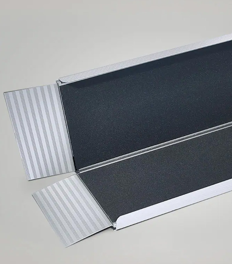 Bi-fold portable wheelchair ramp from National Ramp collapses easily for travel and storage.