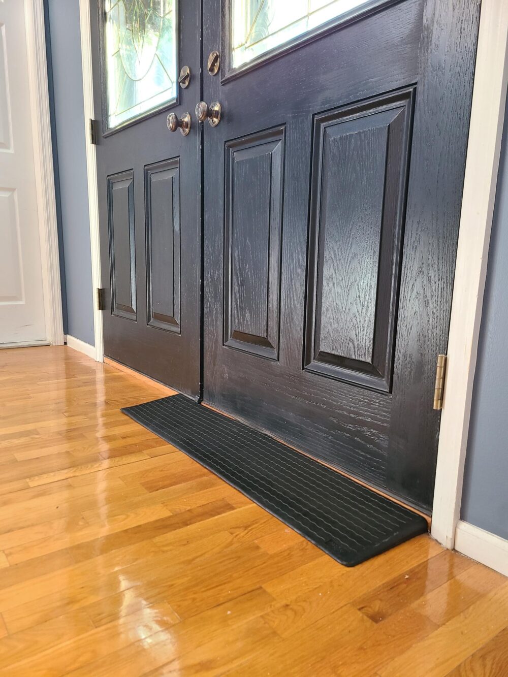 Small rubber threshold ramp from National Ramps in front of client's door