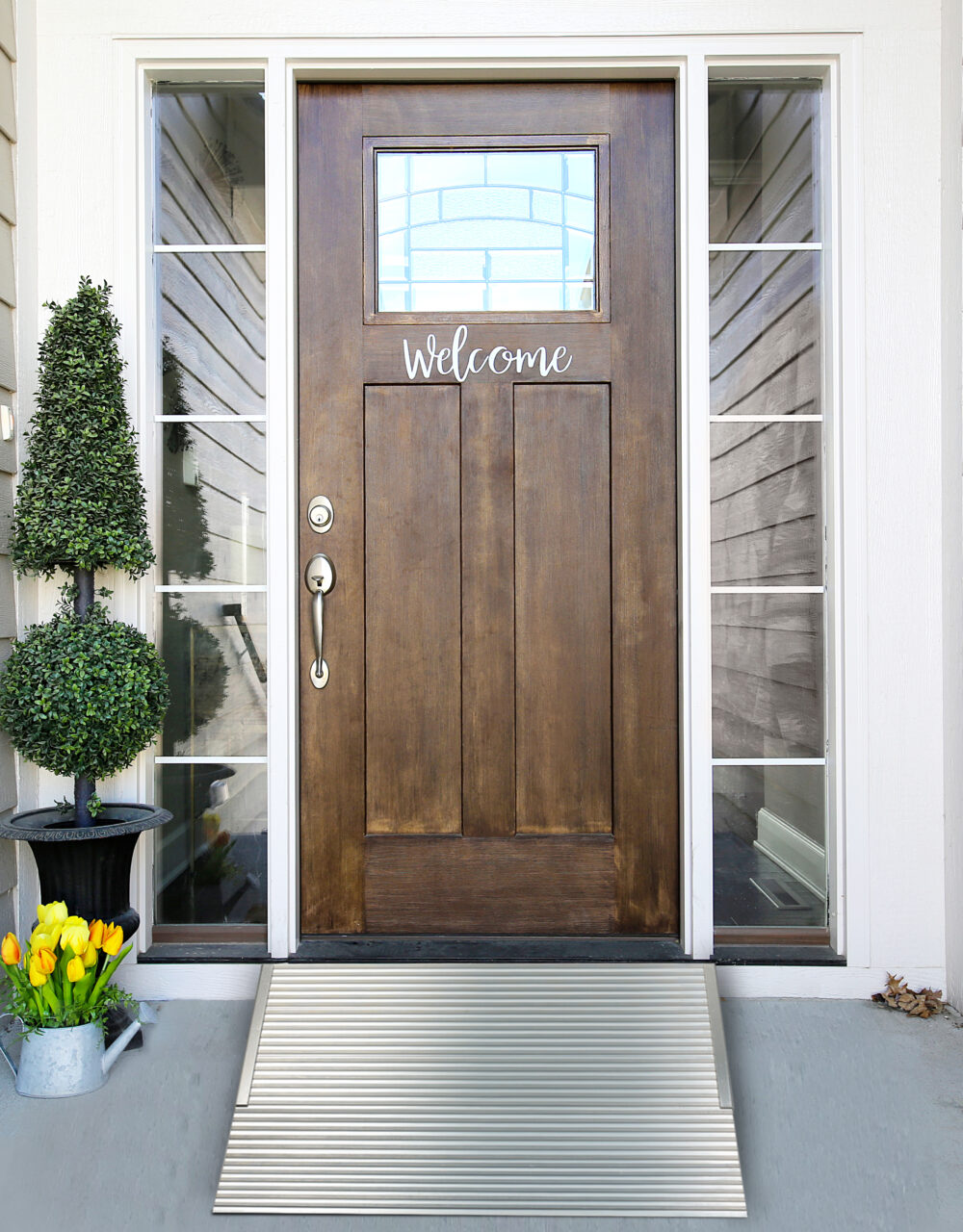 Front view of aluminum threshold ramp from National Ramps in front of beautiful wood door