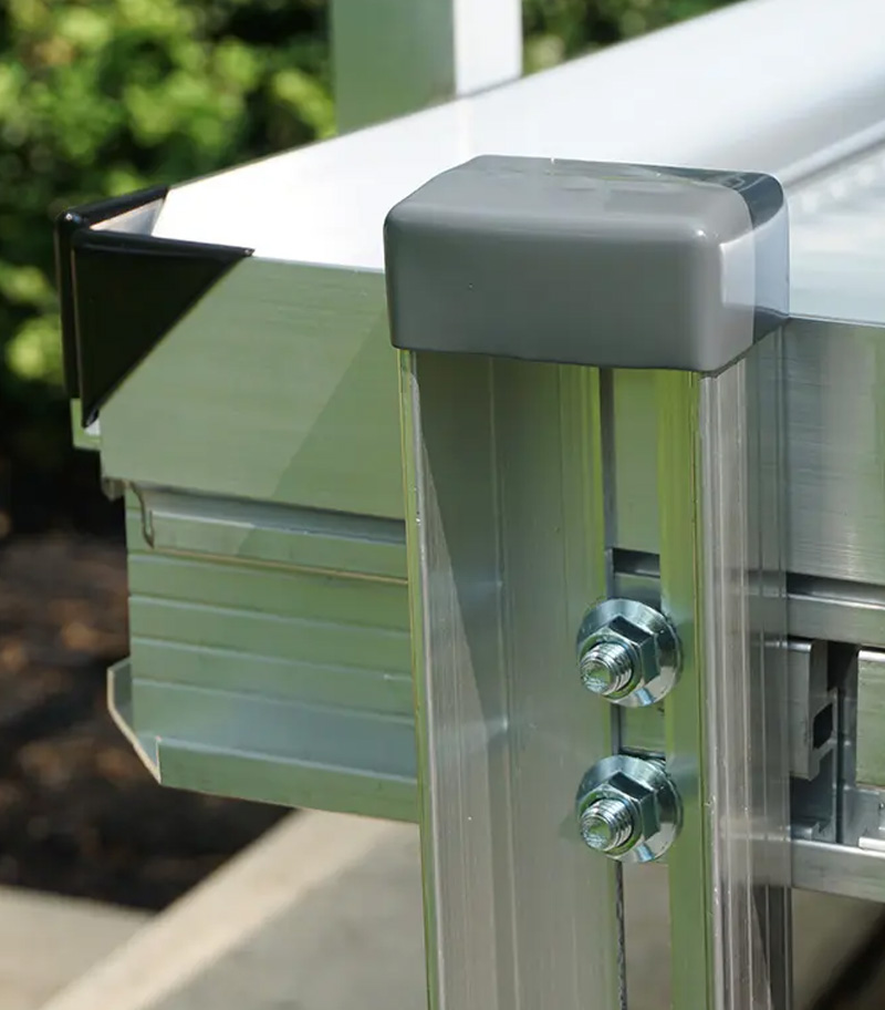 Adjustable leg on aluminum residential wheelchair ramp from National Ramps eliminates the need for concrete footings
