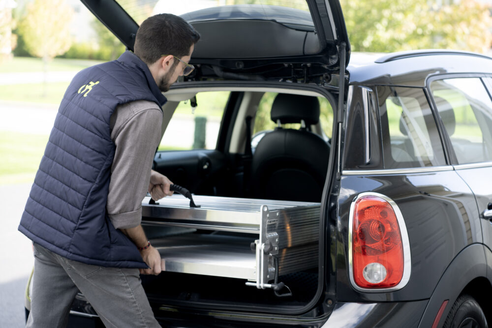 Aluminum Portable Wheelchair Ramp from National Ramps being easily stowed in car's trunk