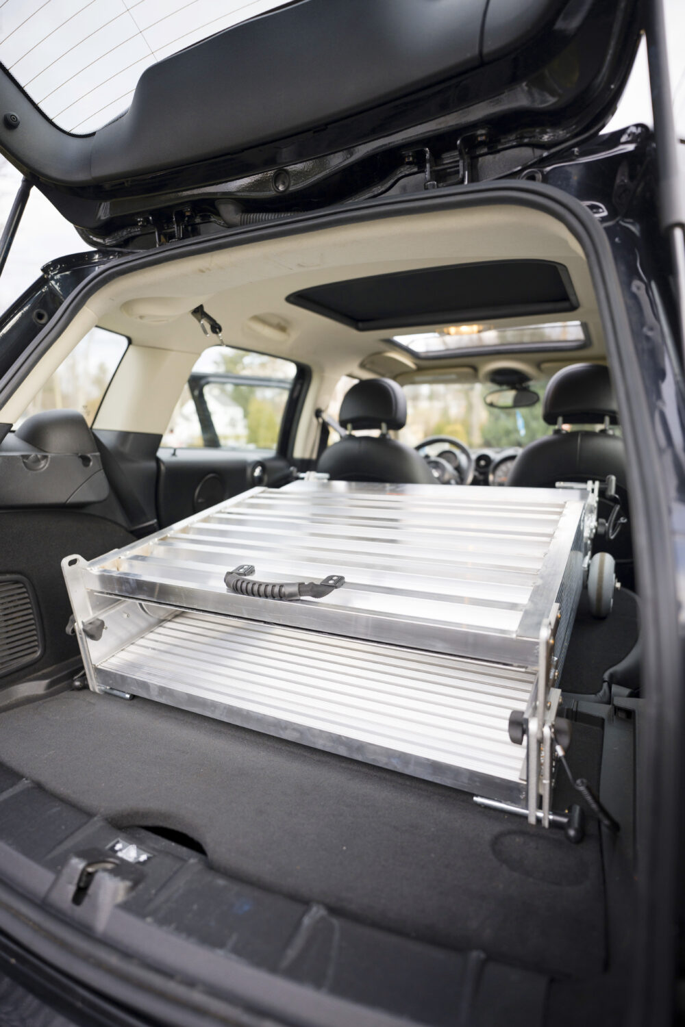 Folding portable wheelchair ramp from National Ramps easily fits into most trunks so you can bring accessibility with you.