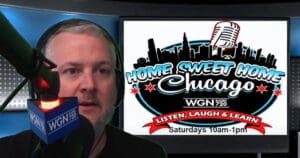 A man speaks into a WGN radio microphone in a studio. Next to him is a screen displaying the Home Sweet Home Chicago show logo, with broadcast times and a Chicago skyline graphic.