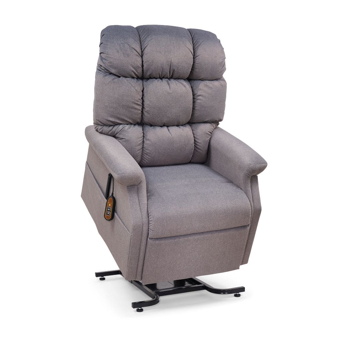 The Cambridge Medium - Lift Chair by Golden Technologies features gray upholstery, padded cushions, wide armrests, and a side-attached remote control. Shown partially lifted on a black metal base. The Cambridge Medium - Lift Chair by Golden Technologies features gray upholstery, padded cushions, wide armrests, and a side-attached remote control. Shown partially lifted on a black metal base.