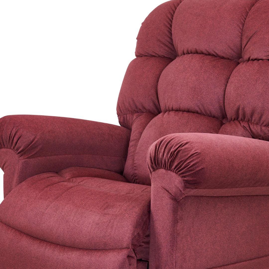 A close-up of the Cloud Medium/Large - Lift Chair by Golden Technologies, featuring plush maroon upholstery, soft tufted cushions, padded armrests, and adjustable comfort, shown against a white background. A close-up of the Cloud Medium/Large - Lift Chair by Golden Technologies, featuring plush maroon upholstery, soft tufted cushions, padded armrests, and adjustable comfort, shown against a white background.