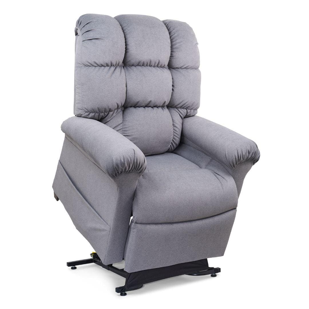 The Cloud Medium Large - Lift Chair by Golden Technologies is a gray, plush power recliner with padded armrests and backrest, featuring a base that elevates to assist with standing, shown against a white background. The Cloud Medium Large - Lift Chair by Golden Technologies is a gray, plush power recliner with padded armrests and backrest, featuring a base that elevates to assist with standing, shown against a white background.