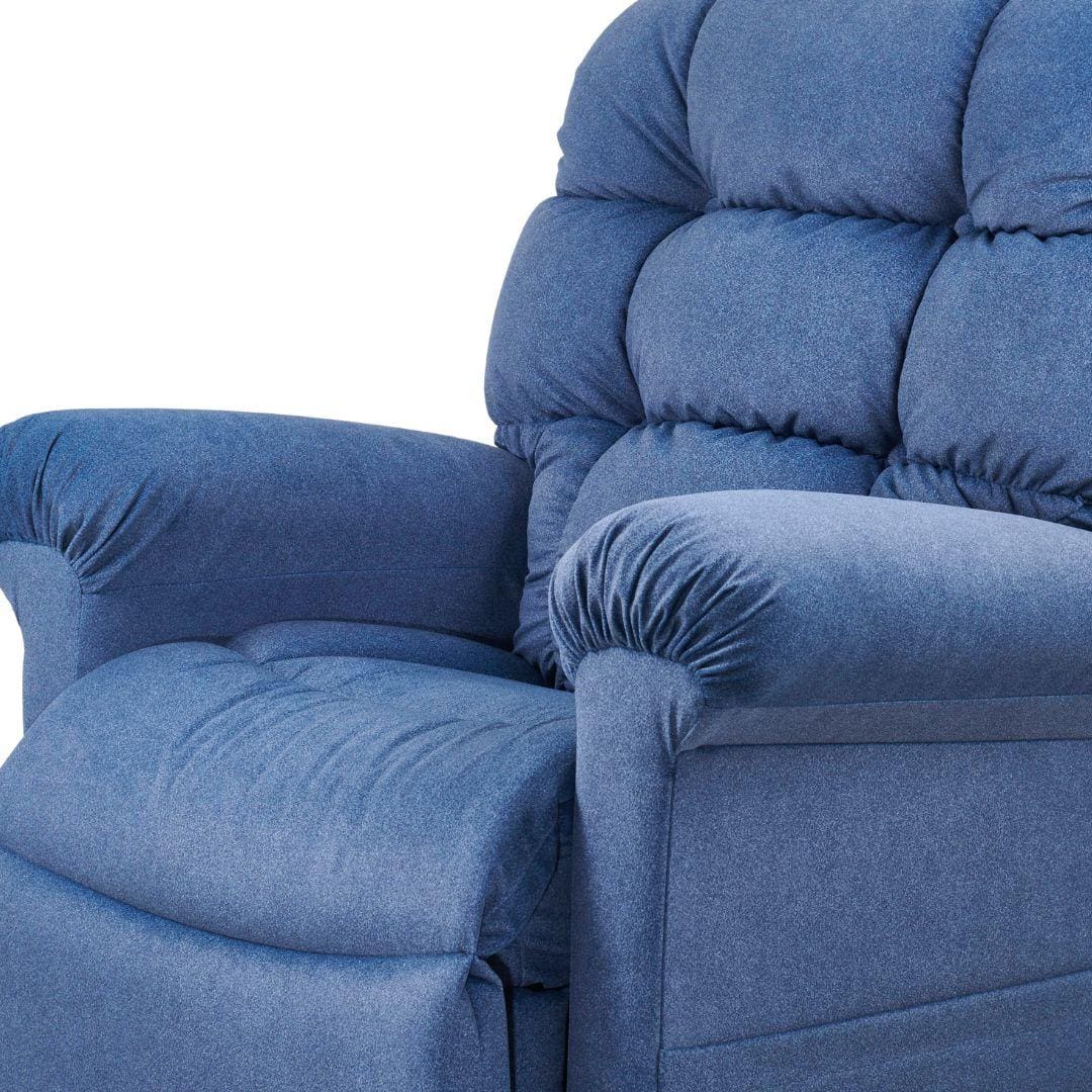 Close-up of the Cloud Small Medium - Lift Chair by Golden Technologies in plush blue upholstery, showing padded armrests, seat, and tufted backrest. The image highlights the right side of this comfortable adjustable recliner. Close-up of the Cloud Small Medium - Lift Chair by Golden Technologies in plush blue upholstery, showing padded armrests, seat, and tufted backrest. The image highlights the right side of this comfortable adjustable recliner.