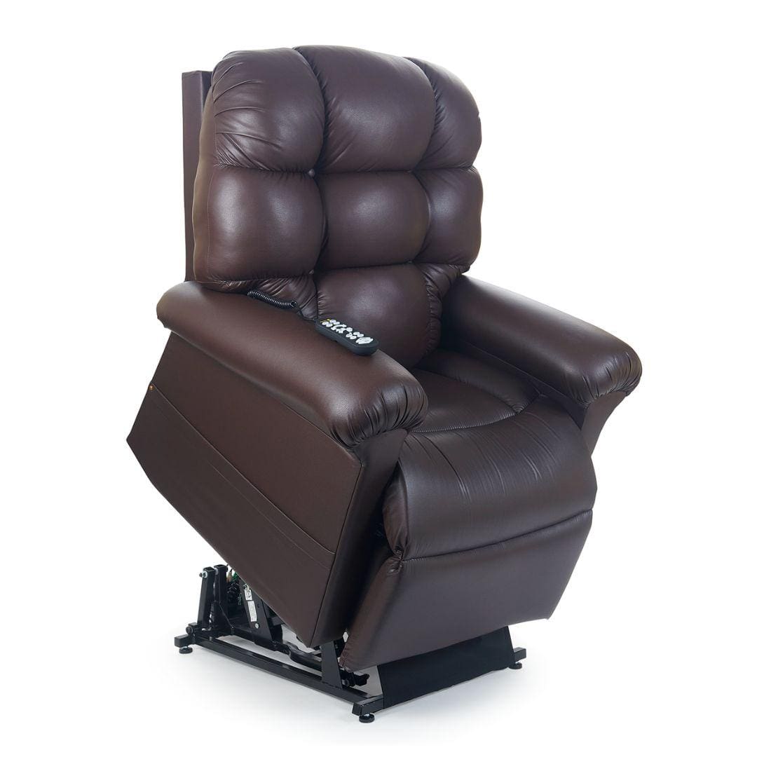 A dark brown Cloud with Twilight Medium/Large Lift Chair by Golden Technologies recliner is shown lifted, revealing its black metal mechanism and a remote control resting on the plush cushioned seat. A dark brown Cloud with Twilight Medium/Large Lift Chair by Golden Technologies recliner is shown lifted, revealing its black metal mechanism and a remote control resting on the plush cushioned seat.