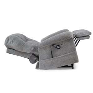 The Cloud with Twilight & Optional Nirvana Small/Medium Lift Chair by Golden Technologies, shown in plush grey and fully extended with a raised footrest, features an attached remote for easy adjustment. The chair is displayed against a white background.