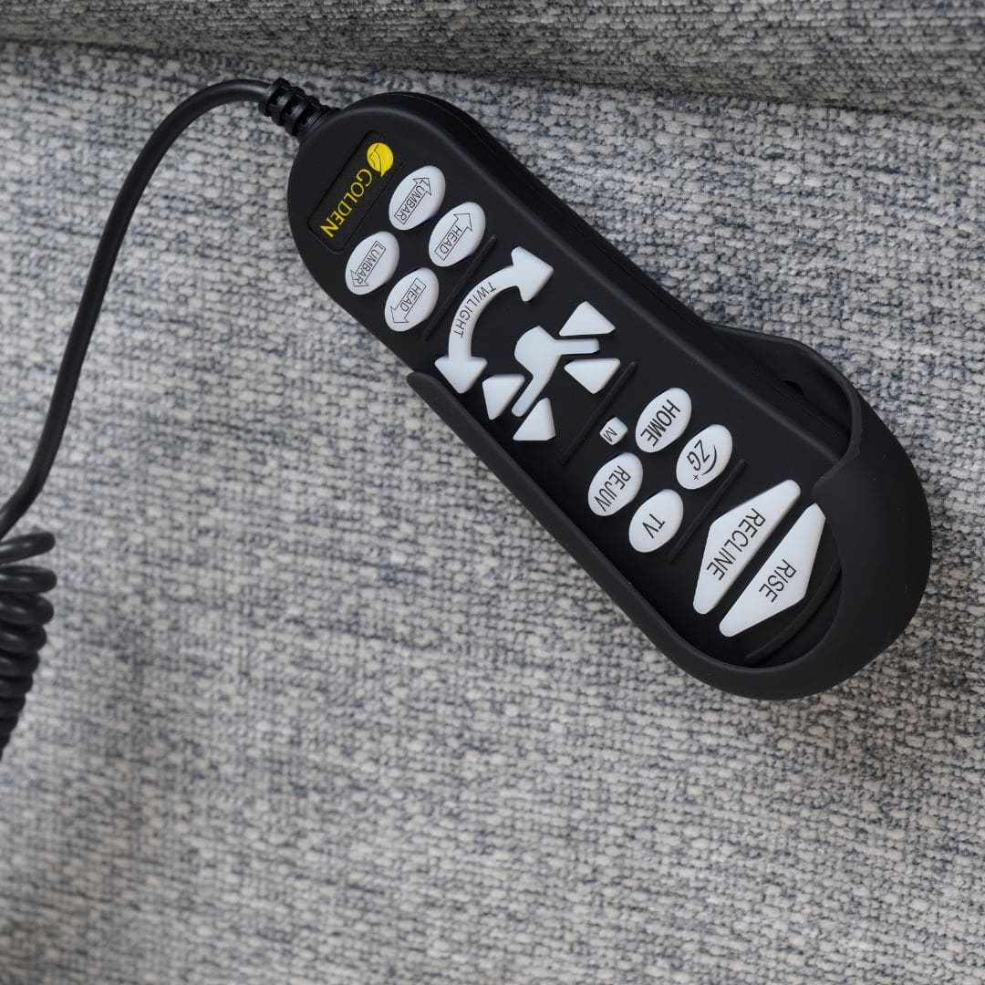 A close-up of a Cloud with Twilight & Optional Nirvana Small/Medium Lift Chair by Golden Technologies remote on gray fabric, with labeled buttons for recline, rise, headrest, TV, home, and sleep—ideal for your lift chair.