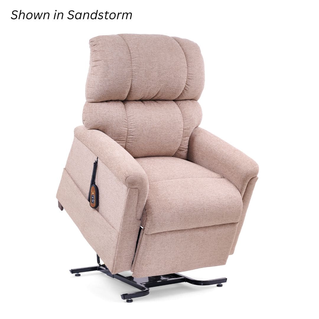 Beige Comforter Large Lift Chair by Golden Technologies with padded backrest, armrests, and a wired remote attached to the side. Power recliner shown with raised base. Text in corner reads Shown in Sandstorm.
