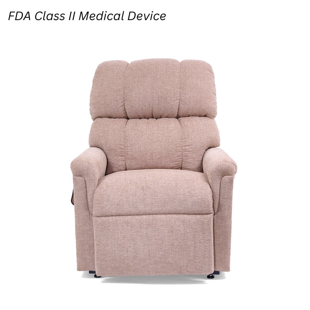 The Comforter Medium - Lift Chair by Golden Technologies, upholstered in beige, is displayed against a white background. Text in the top left says, FDA Class II Medical Device. The Comforter Medium - Lift Chair by Golden Technologies, upholstered in beige, is displayed against a white background. Text in the top left says, FDA Class II Medical Device.