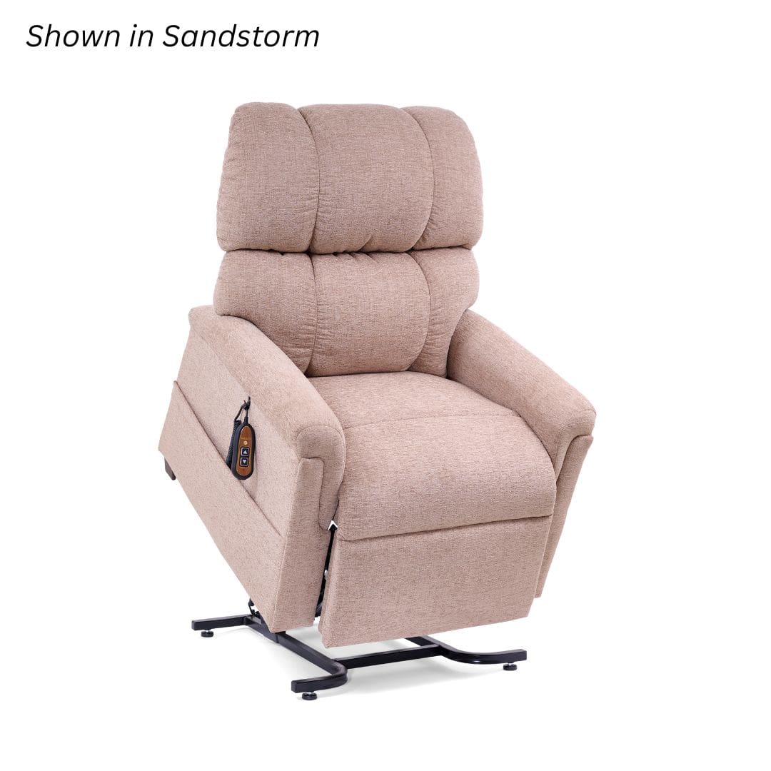 The Comforter Medium - Lift Chair by Golden Technologies is shown in Sandstorm with plush beige upholstery, partial lift, and a remote attached to the side. The Comforter Medium - Lift Chair by Golden Technologies is shown in Sandstorm with plush beige upholstery, partial lift, and a remote attached to the side.