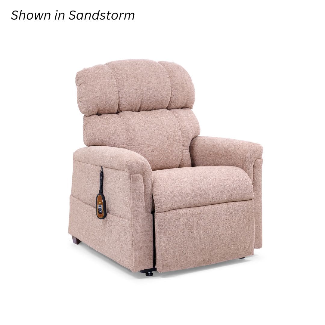 The Comforter Petite Small - Lift Chair by Golden Technologies is upholstered in light beige Sandstorm, featuring plush cushioning, wide armrests, and a remote attached to the side, set against a plain white background. The Comforter Petite Small - Lift Chair by Golden Technologies is upholstered in light beige Sandstorm, featuring plush cushioning, wide armrests, and a remote attached to the side, set against a plain white background.