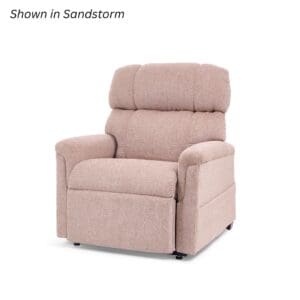 The Comforter Small Wide Lift Chair by Golden Technologies, upholstered in beige (Sandstorm), features a padded backrest, armrests, and footrest. It is pictured against a white background with "Shown in Sandstorm" noted at the top left.