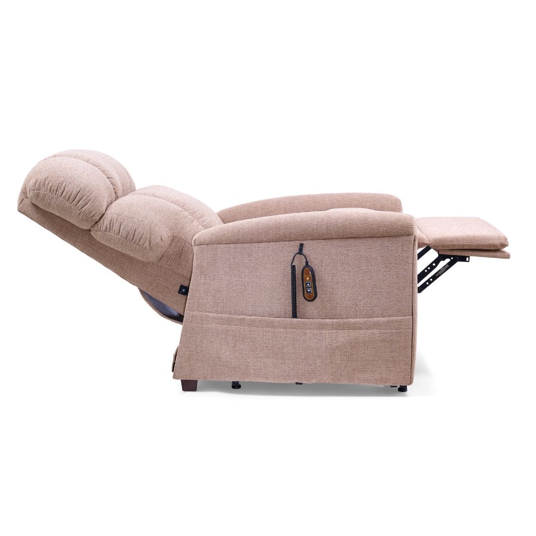 The Comforter Tall - Lift Chair by Golden Technologies in beige is fully extended with its footrest up and a remote control in the side pocket, providing exceptional comfort and convenience. The Comforter Tall - Lift Chair by Golden Technologies in beige is fully extended with its footrest up and a remote control in the side pocket, providing exceptional comfort and convenience.