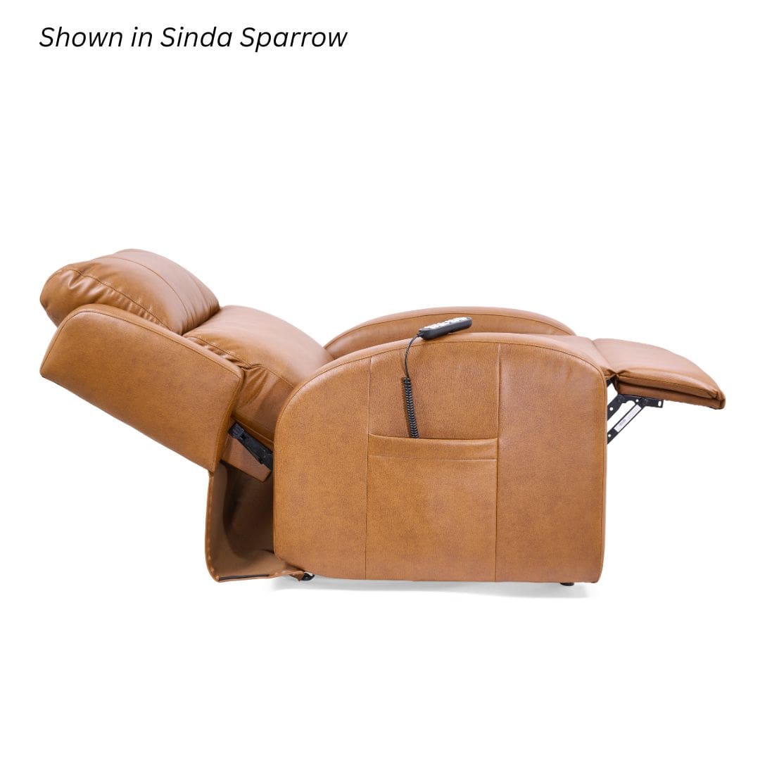 The EZ Sleeper Slim with Twilight Lift Chair by Golden Technologies, shown here in Sinda Sparrow brown leather, is fully reclined with its remote stored in the side pocket. The EZ Sleeper Slim with Twilight Lift Chair by Golden Technologies, shown here in Sinda Sparrow brown leather, is fully reclined with its remote stored in the side pocket.