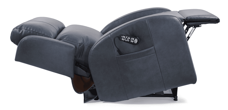 The EZ Sleeper Slim with Twilight - Lift Chair by Golden Technologies, shown fully extended in dark grey leather, displays its footrest and backrest, with a remote control visible in the side pocket of this compact chair.