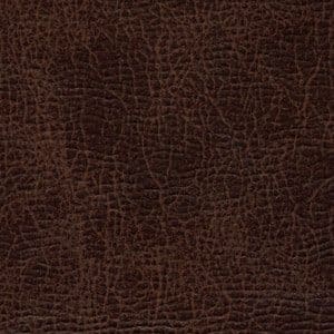 Close-up of dark brown textured leather with visible natural grain and creases, as found on the Titan Medium - Lift Chair by Golden Technologies, offering a rugged and slightly worn look.