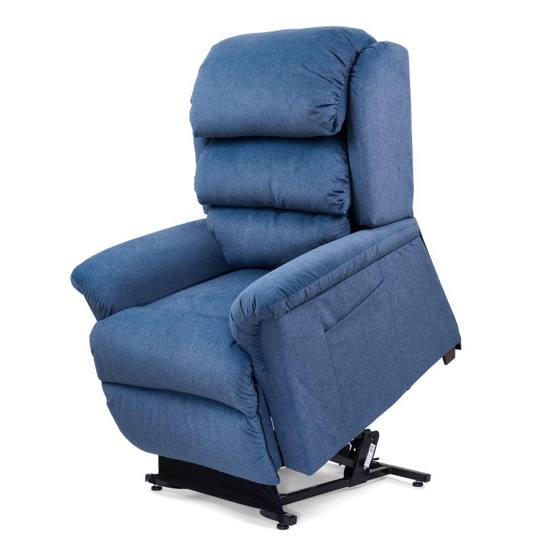 The Relaxer Medium - Lift Chair by Golden Technologies is a blue upholstered recliner with thick cushions, armrests, an extended footrest, and partial metal base elevation for support and adjustable comfort. The Relaxer Medium - Lift Chair by Golden Technologies is a blue upholstered recliner with thick cushions, armrests, an extended footrest, and partial metal base elevation for support and adjustable comfort.