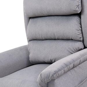 Close-up of the Relaxer Small - Lift Chair by Golden Technologies in plush light gray, featuring a padded armrest and three thick, horizontal backrest cushions. The soft fabric and supportive adjustable cushions provide exceptional comfort.