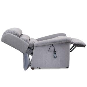 The Relaxer Small - Lift Chair by Golden Technologies features padded armrests and backrest, a compact design, and electronic adjustment via a cabled remote stored in the side pocket for full power recline.