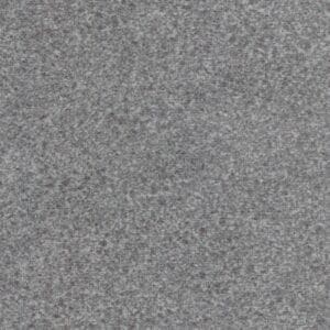 Close-up view of a gray, speckled granite surface with a rough, even texture—reflecting the durable quality of the Relaxer Large - Lift Chair by Golden Technologies—highlighting uniform patterns of small, variously shaded gray mineral grains.